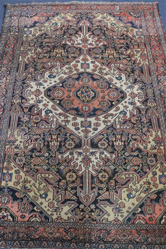 A Persian blue and pink ground medallion rug 190 x 130cm